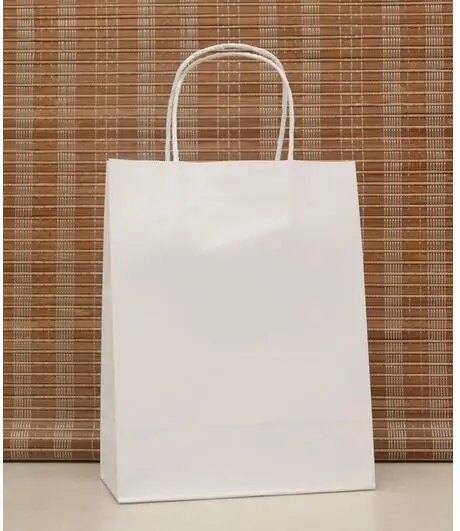 

10PCS/lot white color paper gift bag Festival Paper bag with handles Fashionable cloth bags Excellent Quality 27*21*11cm