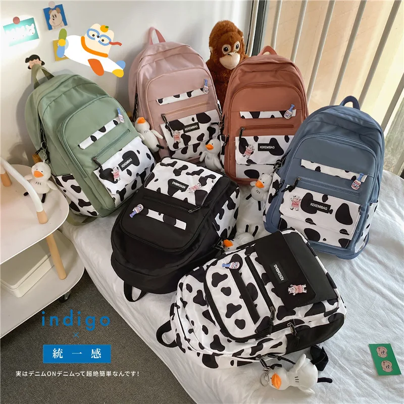 

Хит Цвет одежда с принтом милой коровы; Узор рюкзаки для девочек-подростков из нейлона для девочки с карманами дорожные рюкзаки женская шко...