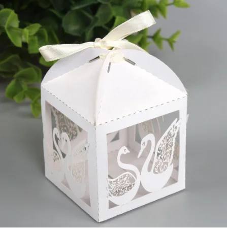 

100Pcs Free shipping Hollow laser Swan Candy BOX Gift Boxes Wedding Party Favor Decoration With Ribbon 50PCS/lot