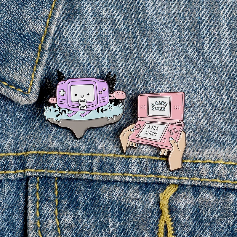 

Pink Purple Cartoon Game Boy Lapel Enamel Pins GAME OVER Casual Brooches Badges Clothes Bag Pins Jewelry Gifts For kids friends