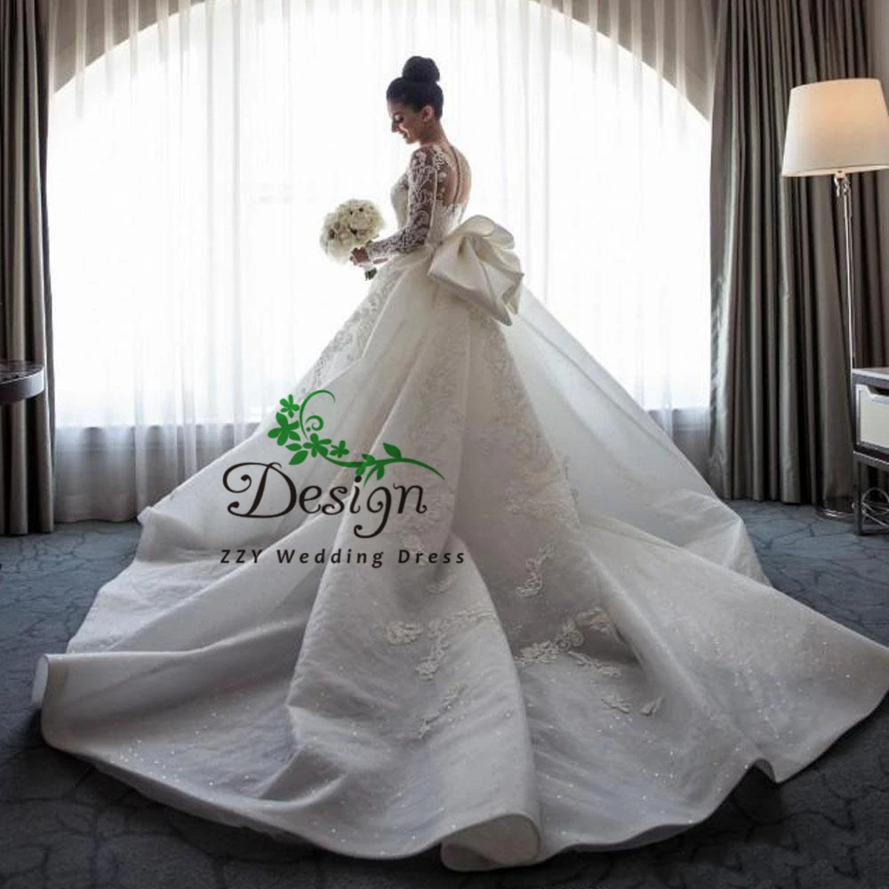 

2020 Luxury Mermaid Wedding Dresses Boat Neck Long Sleeves Illusion Full Lace Appliqued Bow Overskirts Button Back Bridal Dress