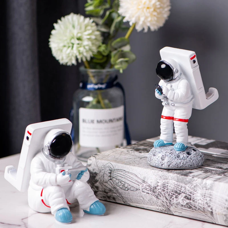 homhi astronaut mobile phone holder creative resin spaceman figurine statue nordic home room decoration accessories hbj 038 free global shipping