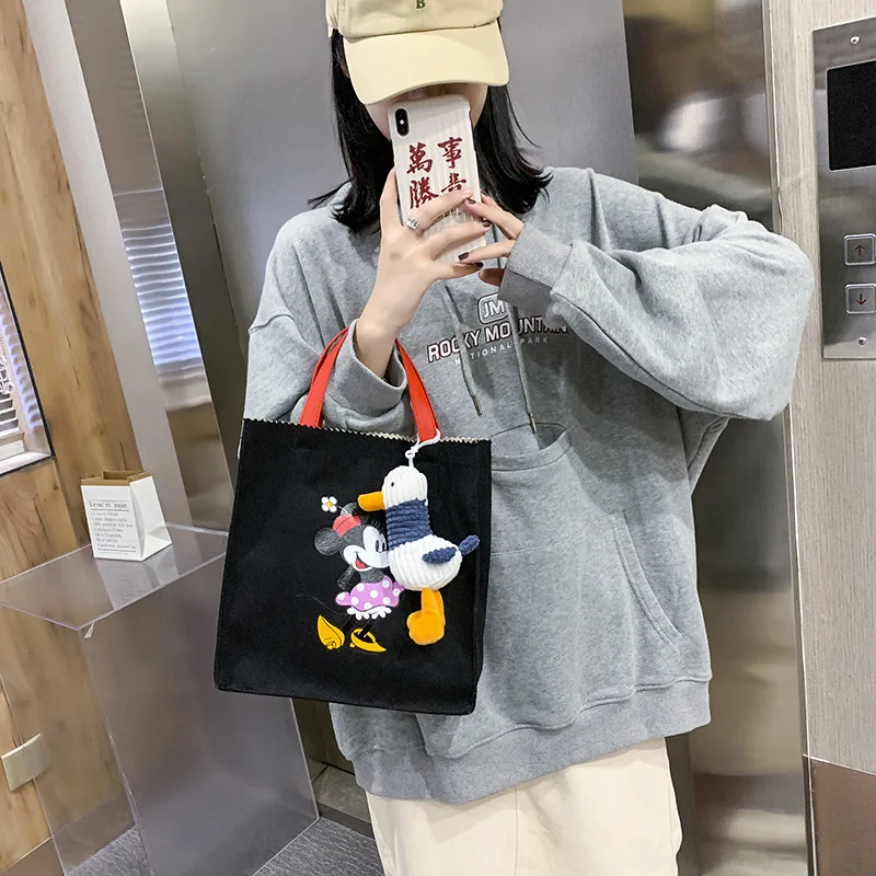 

Disney 2021 Mickey Mouse Minnie shoulder bag non-woven Joker shopping Tote cartoon messenger bag