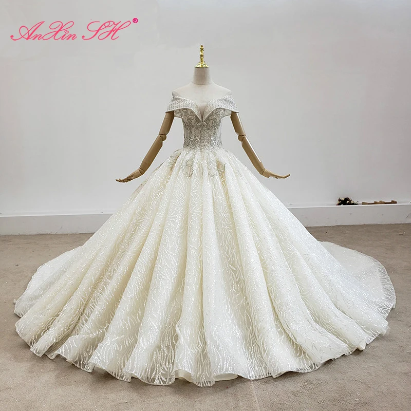 

AnXin SH luxury princess beading crystal pearl illusion handmade boat neck white flower lace bride wedding dress 100% real photo