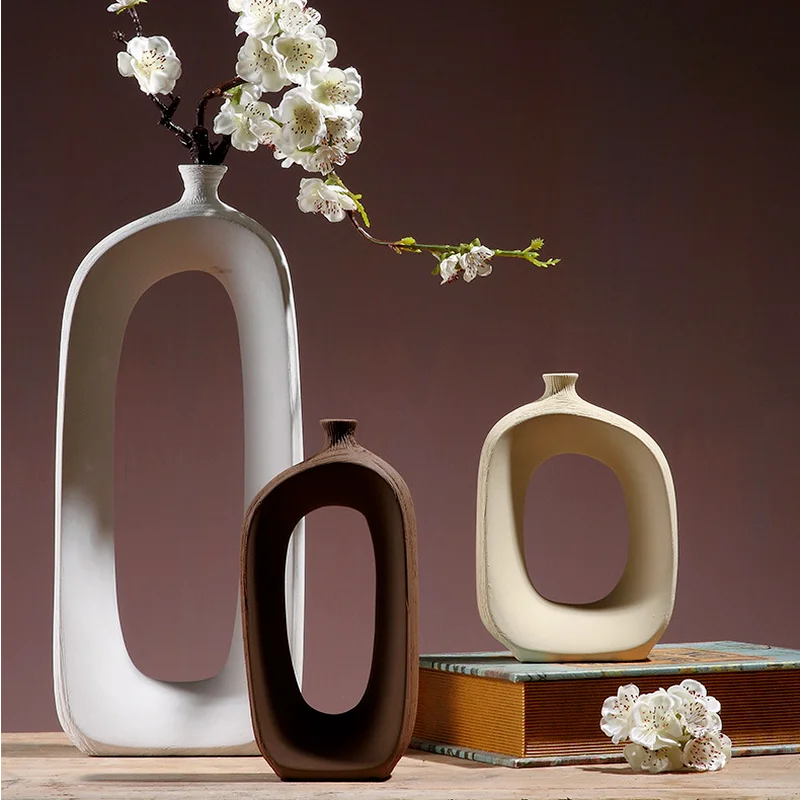 

Abstract Shaped Hollow Ceramic Vase Flower Arrangement Dried Flower Desktop Decorative Art Irregular Vase Crafts Home Decoration
