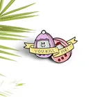 Эмалированная брошь в виде пальмовой игровой консоли, с надписью You Kill Me