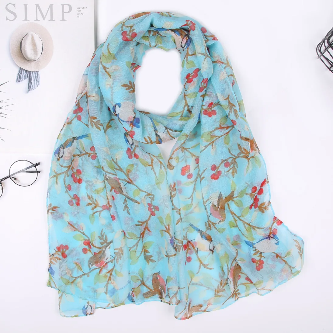 

New Parisian animal scarf printed with branches and birds