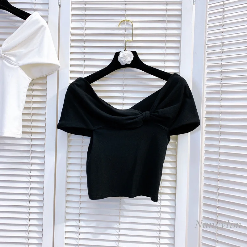 Camiseta de verano para mujer, Top corto de algodón elástico con lazo grande y hombros irregulares, ajustada, manga corta, blanco y negro, 2021