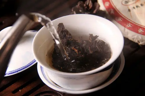 

2012 Liming Golden Peacock Tea Premium Menghai Ripe Shu Shou Pu-erh Cake 357g