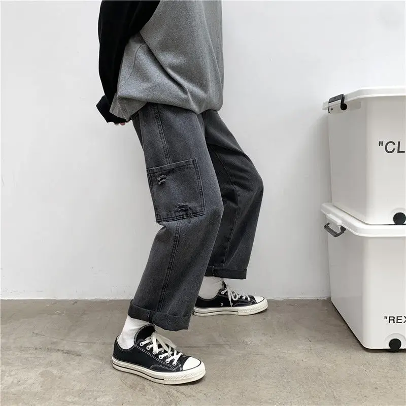 

Джинсы мужские с широкими штанинами, модные повседневные брюки из денима в Корейском стиле ретро, с карманами, свободные рваные прямые штан...