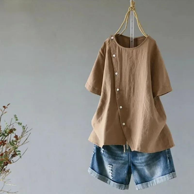 2019 summer new large size cotton and linen women's short-sleeved O-neck button irregular hem blouse |