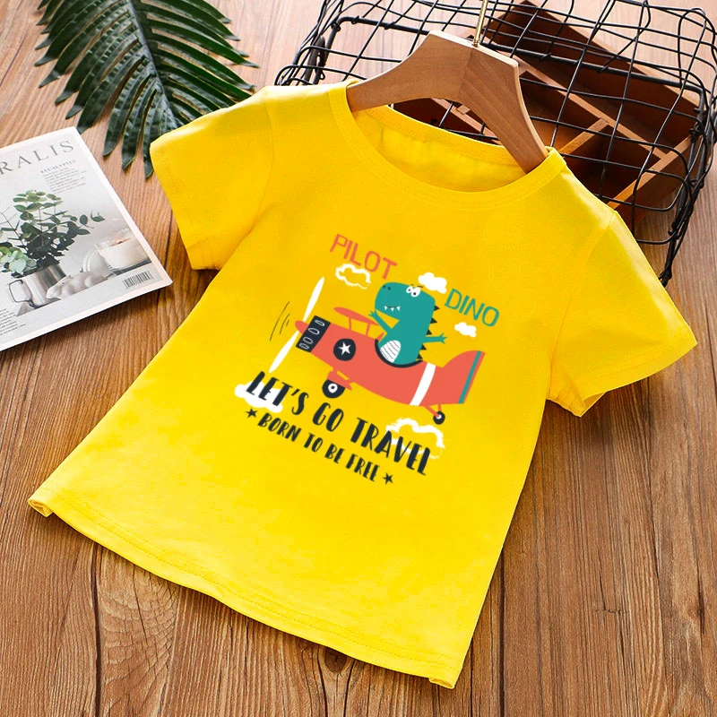

Clothing for Girls A Short Sleeved Cotton Print top With a Cartoon Dinosaur Flying a Plane Fashion Lovely T-Shirt For a Boys