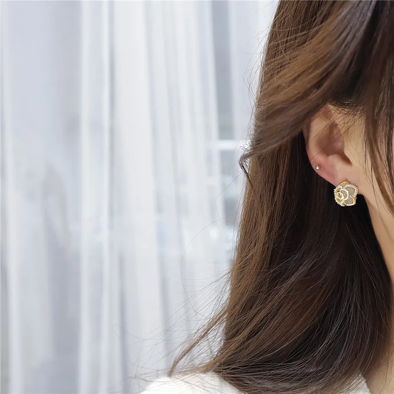 

Romantic S925 Silver Needle Temperament Flower Cat Eye Gold Stud Earrings for Woman Fashion Statement Earrings Jewelry Gift