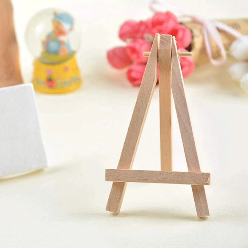 

PPYY-12 Pack 5 Inch Mini Wood Display Easel Natural Wooden Tripod Holder Stand for Displaying Small Canvases and Photos