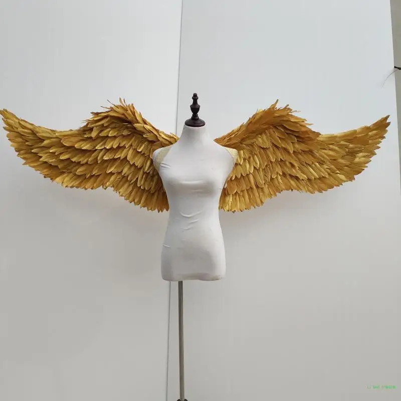 

a stage performance of gold and silver plumes of angel wings Catwalk model shows