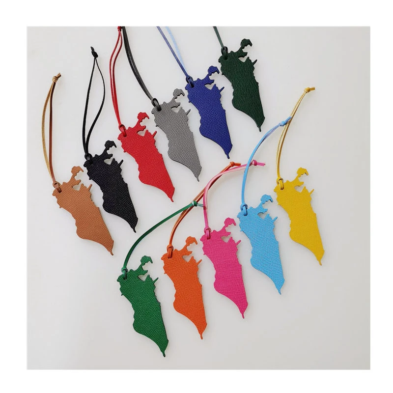 

Wholesale luxury real natural leather various colors of Bahrain map keychain backpack pendant lady bag charm