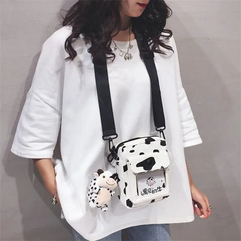 

Korean version ins funny personality color contrast cow wave point girl student canvas bag Japanese cute messenger bag