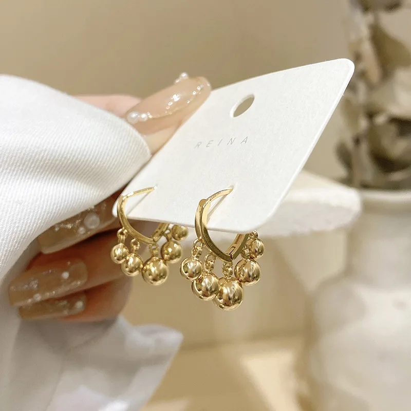 

South Korea's new French retro tassel golden pea pendant earrings female fashion small fresh earrings