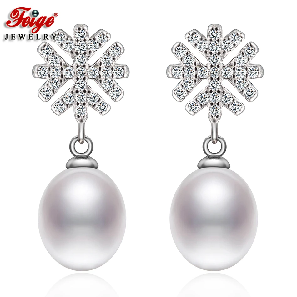 

Женские серьги-гвоздики в виде Снежинки из стерлингового серебра 925 пробы с белым натуральным эллипсом и пресноводным жемчугом, рождествен...