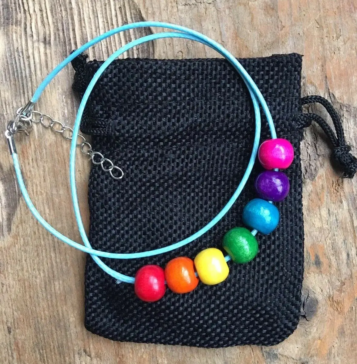 

Rainbow Multi Coloured Wooden Beaded Necklace On blue Cord + Gift Bag