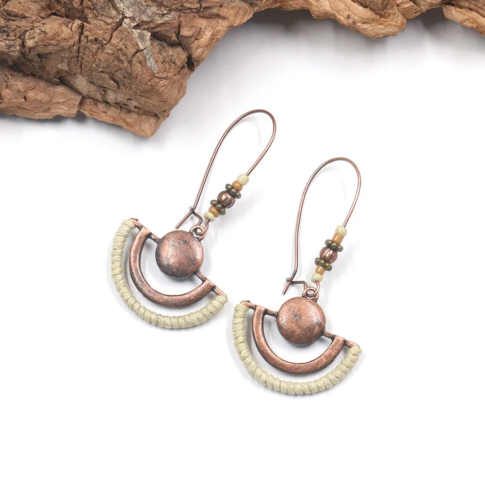 

New retro geometric hollow oval alloy earrings hand-wound rice bead ear hook accessories female earrings