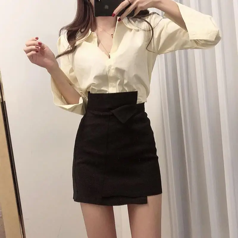 

Skirt design female irregular A bag hip skirt high waist Joker solid color shirt two-piece autumn new style