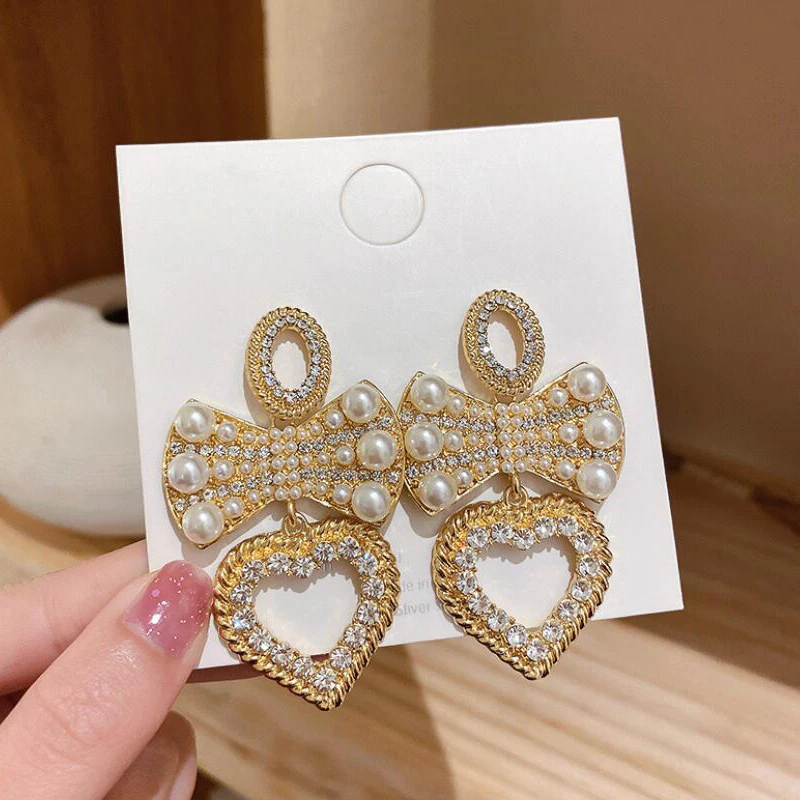 

Big Exaggerated Imitation Pearl Drop Earrings For Women Elegant Heart Bowkont Shiny Crystal Earings Fashion Jewelry Party Gifts