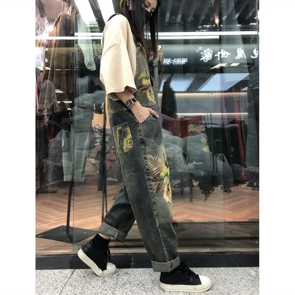 

Spring and autumn new age reducing floral contrast washed jeans carrying pants women's large loose one-piece casual Harlan pants
