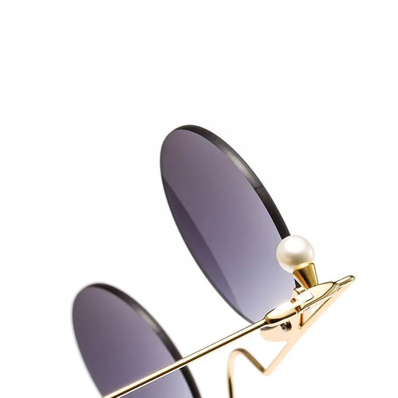 

Women Sunglasses New Personality Small Circle Frameless Colored Pearl Decoration Fashion Luxury Glasses