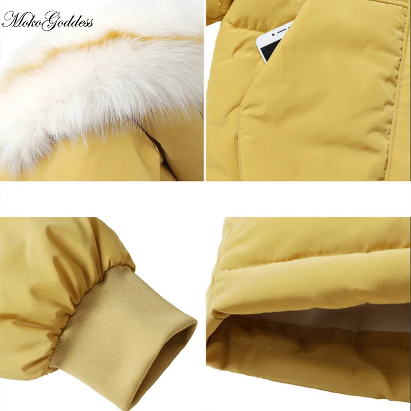 Женская зимняя куртка средней длины с меховым воротником и капюшоном | одежда