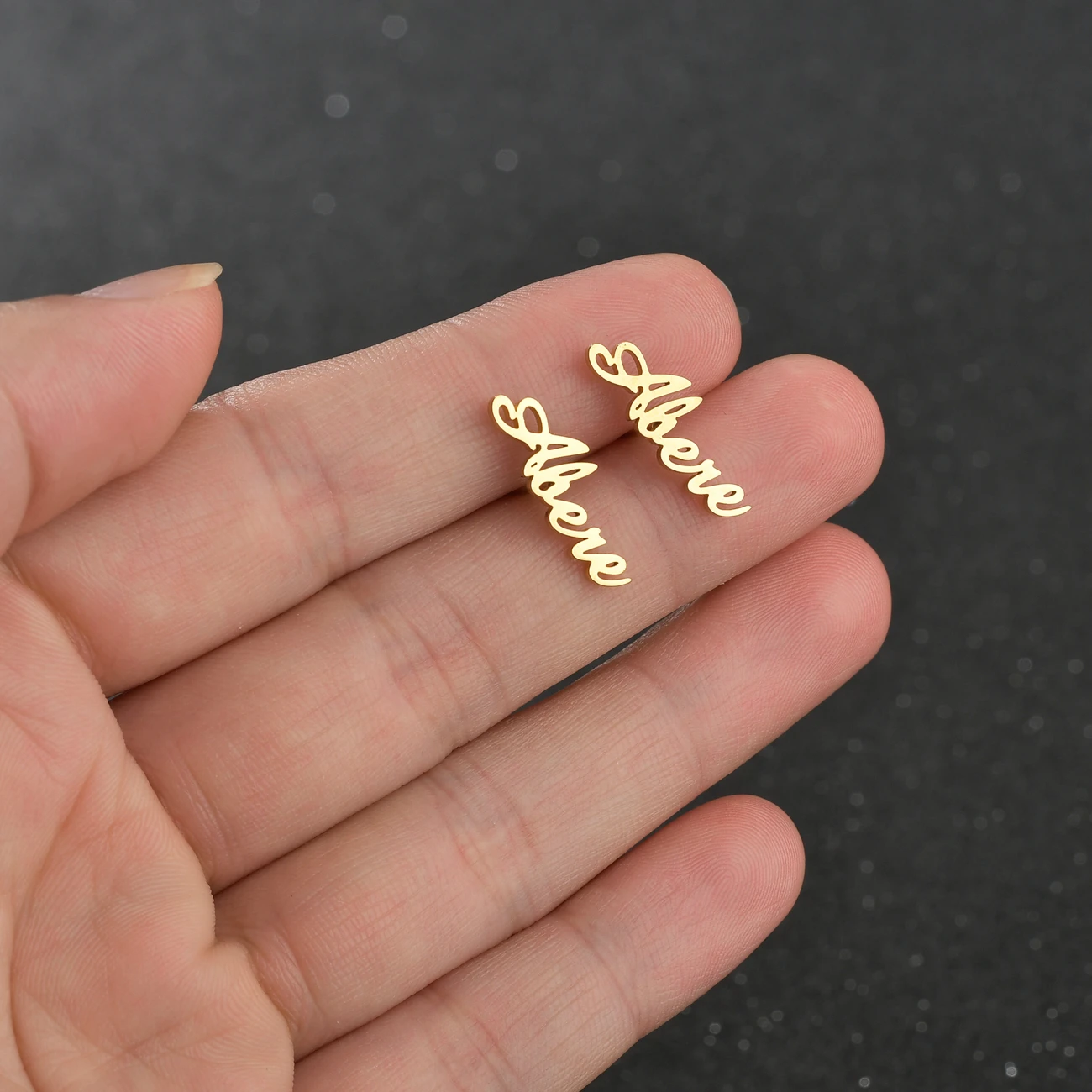 

Goxijite Customized Name Letter Stud Earrings For Women Girls Stainless Steel Name Piercing Earrings Cursive Nameplate Gift
