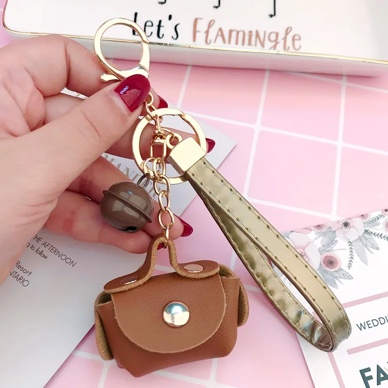 

Cute bag key chain female creative leather small bag leather rope key chain ring pendant DIY bell accessories