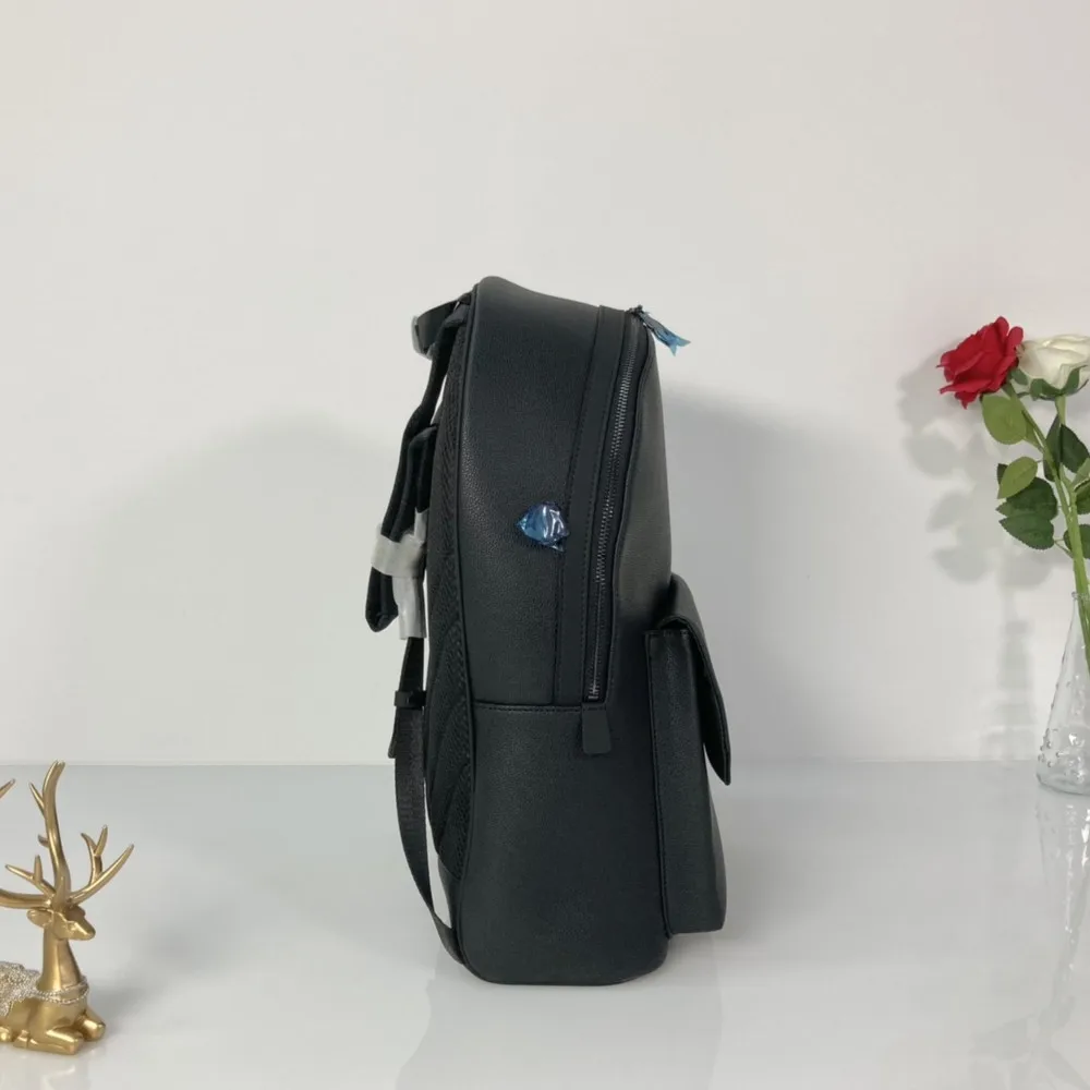 

Leather arc school bag boy large-capacity backpack travel mobile phone notebook men's backpack teenager school bag