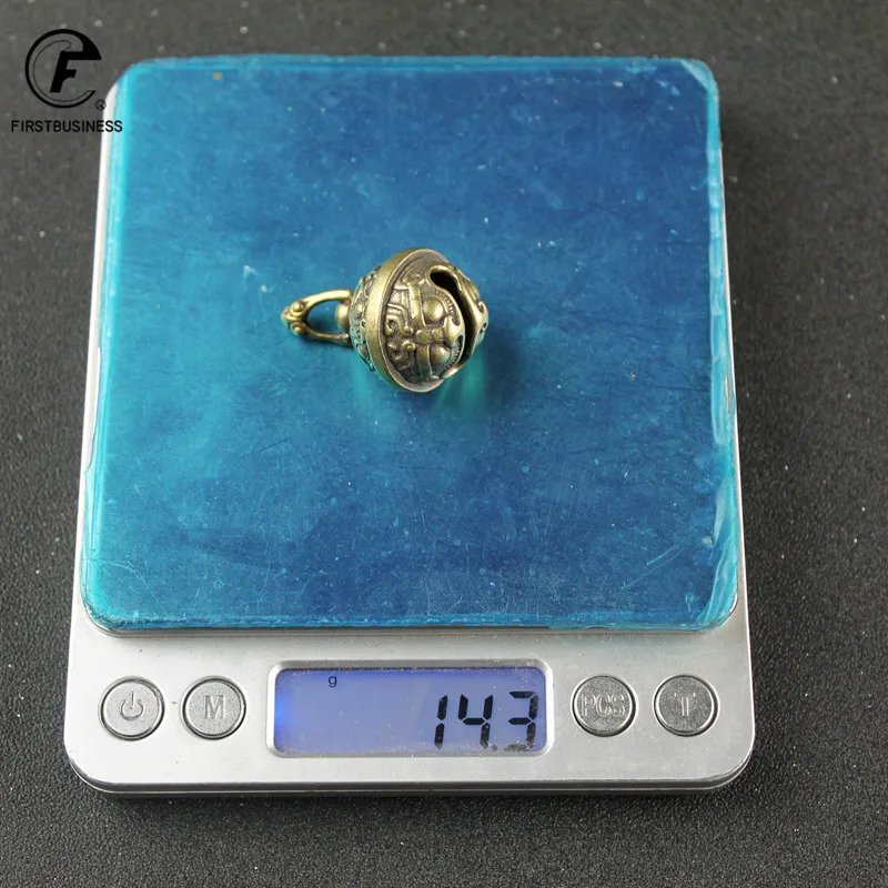 

Медный брелок-колокольчик с лицом животного