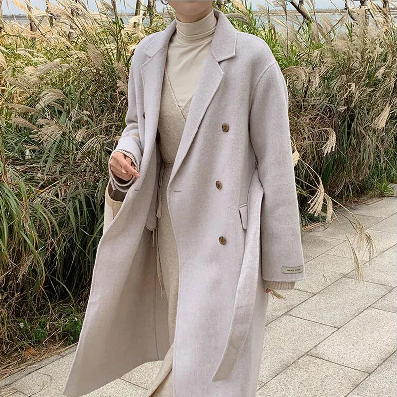 

Autumn and winter women's coat casual solid color double-breasted belt decoration long coat