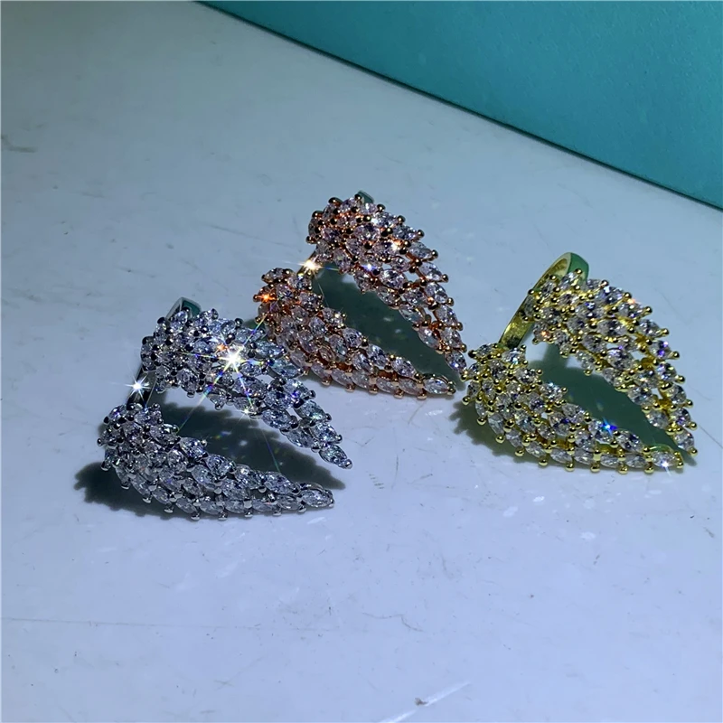 Элегантное кольцо с ангельским крылом и перьями полным кубическим цирконием