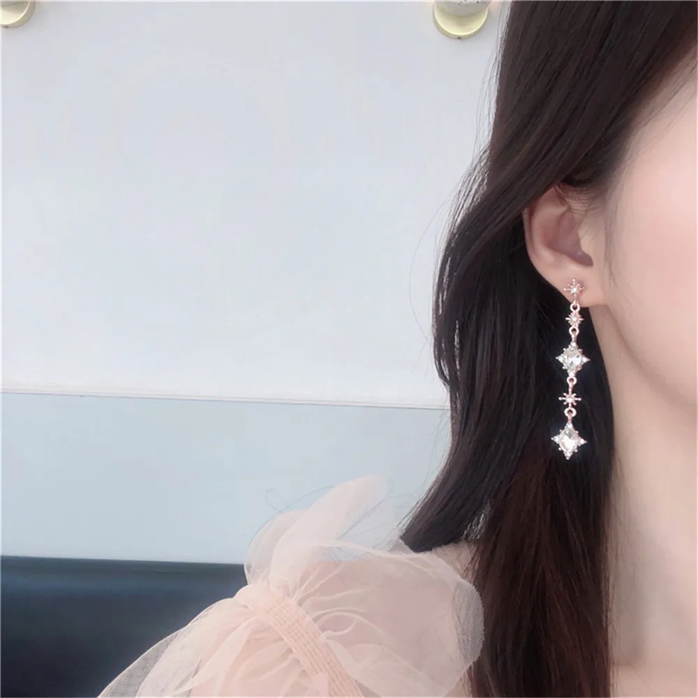 

2021 New Fashion Jewelry White Crystal Simple Drop Pendientes Elegant Dangle Earings Queen Accesories Stainless Steel Earrings