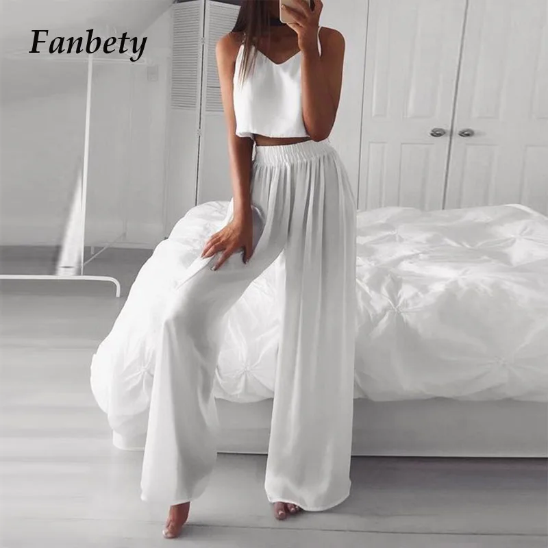 

Комплект из двух предметов женский однотонный, элегантный пикантный верх с лямками и широкие штаны, модный свободный костюм без рукавов с о...