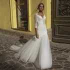 Платье свадебное с юбкой-годе, полурукавом и кружевной аппликацией на спине