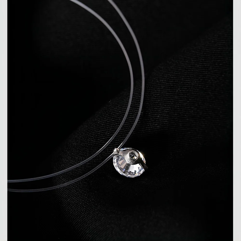 Женский чокер из прозрачной лески с кулоном фианита |