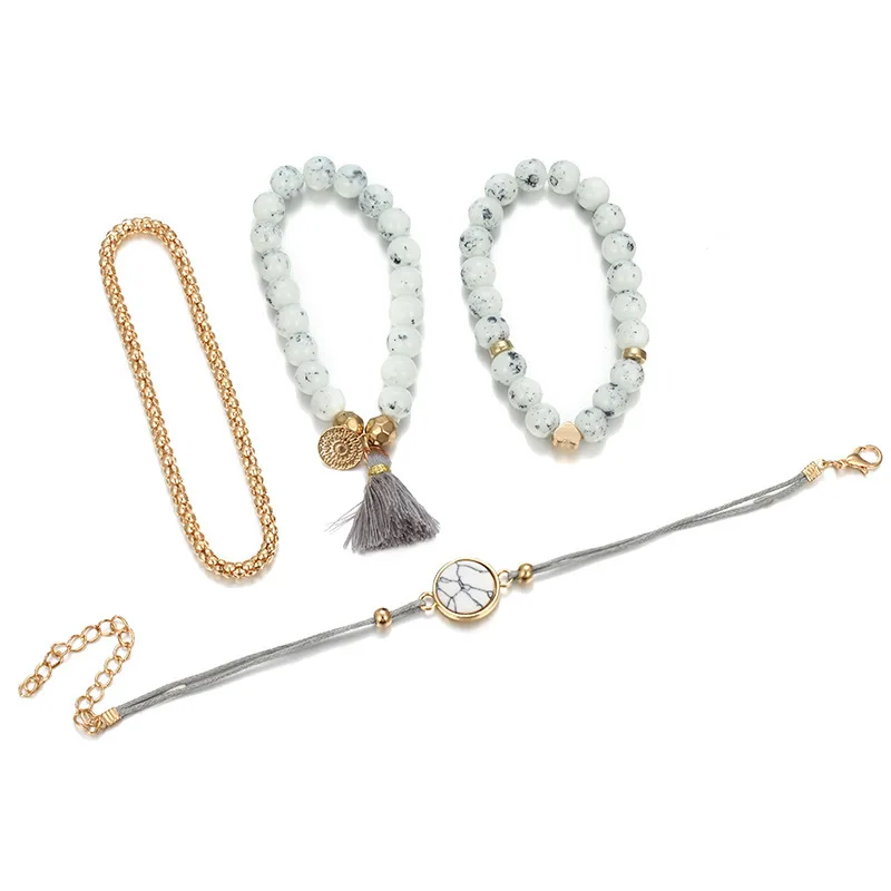 Simple and creative geometric hollow metal round piece turquoise love tassel pendant bracelet four-piece set | Украшения и