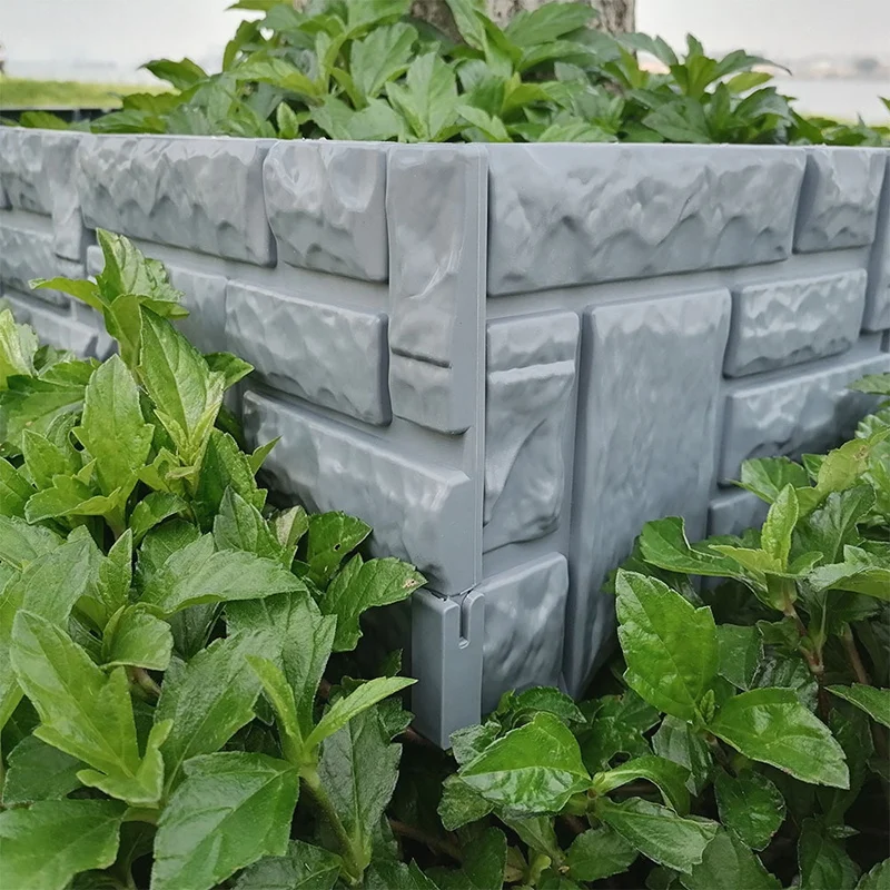 Большая сделка лужайка окантовка границы растений серый камень кирпич цветок