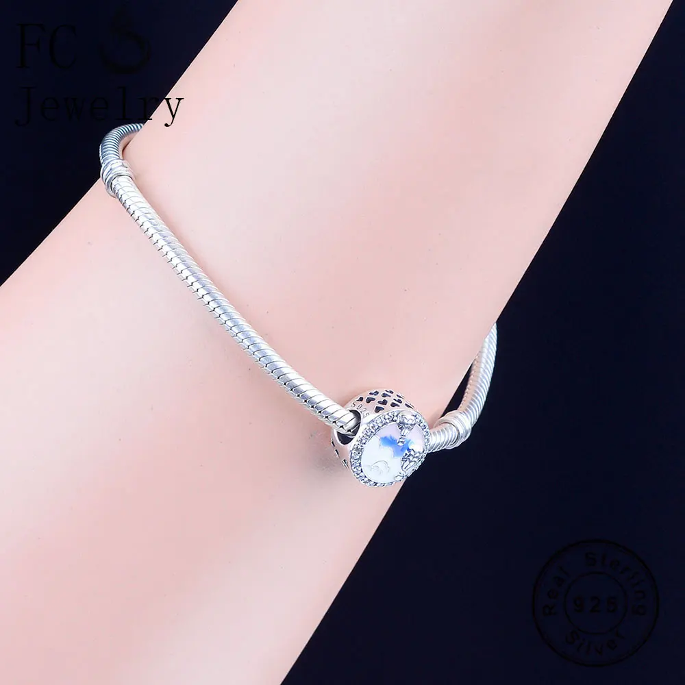 Браслет из серебра 925 пробы с подвесками в виде горячего воздушного шара и надписью на голубой эмали.