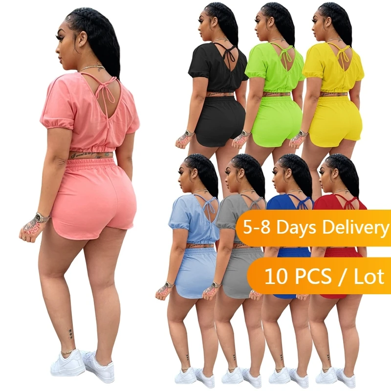 

Оптовая продажа летних женских спортивных костюмов из 2 предметов, повседневный спортивный костюм для фитнеса, Женский бандажный укороченный топ с открытой спиной и шорты