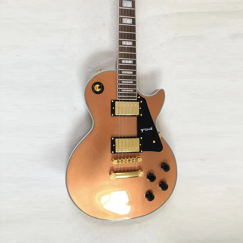 

Classic brand electric guitar, metal orange paint, selected mahogany core solid wood, gold accessories, free delivery to home.