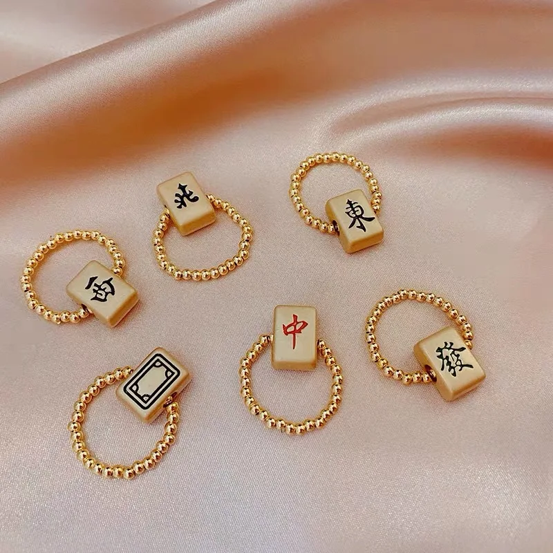 

2021 New South East Northwest Red Zhongfa Cai Whiteboard Ring Mahjong Lucky Turn Bead Index Finger Ring Fashion Beaded Ring