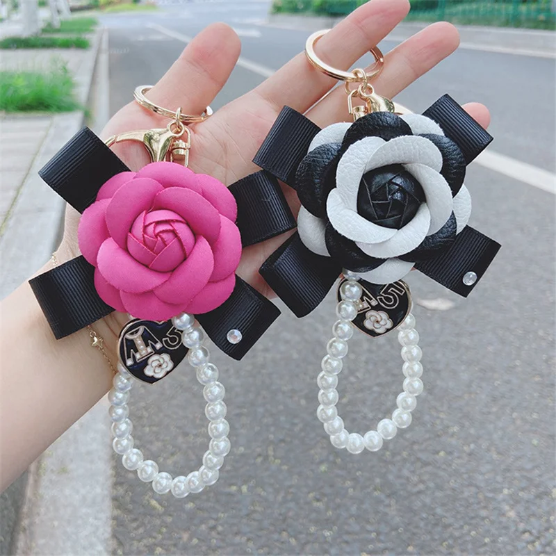 

Classic PU Leather Camellia Flower Pearl Keychain Bag Pendant Ornament Car Key Women Bag Accessories Jewelry Trinkets Gifts