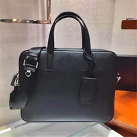 the new briefcase is made of imported saffiano cross grain cowhide detachable and adjustable nylon shoulder strap design looks