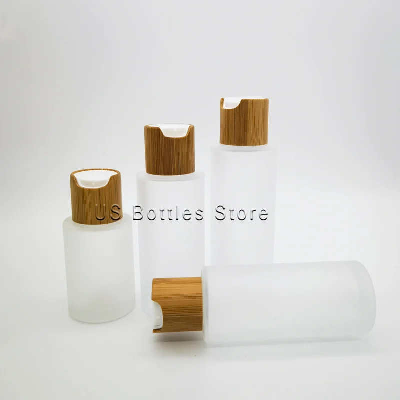 

50pcs 30ml 1 oz Wooden Natural Bamboo Cap Glass Lotion Bottle Cosmetic Transparent Frosted Spray Pump Packaging Container
