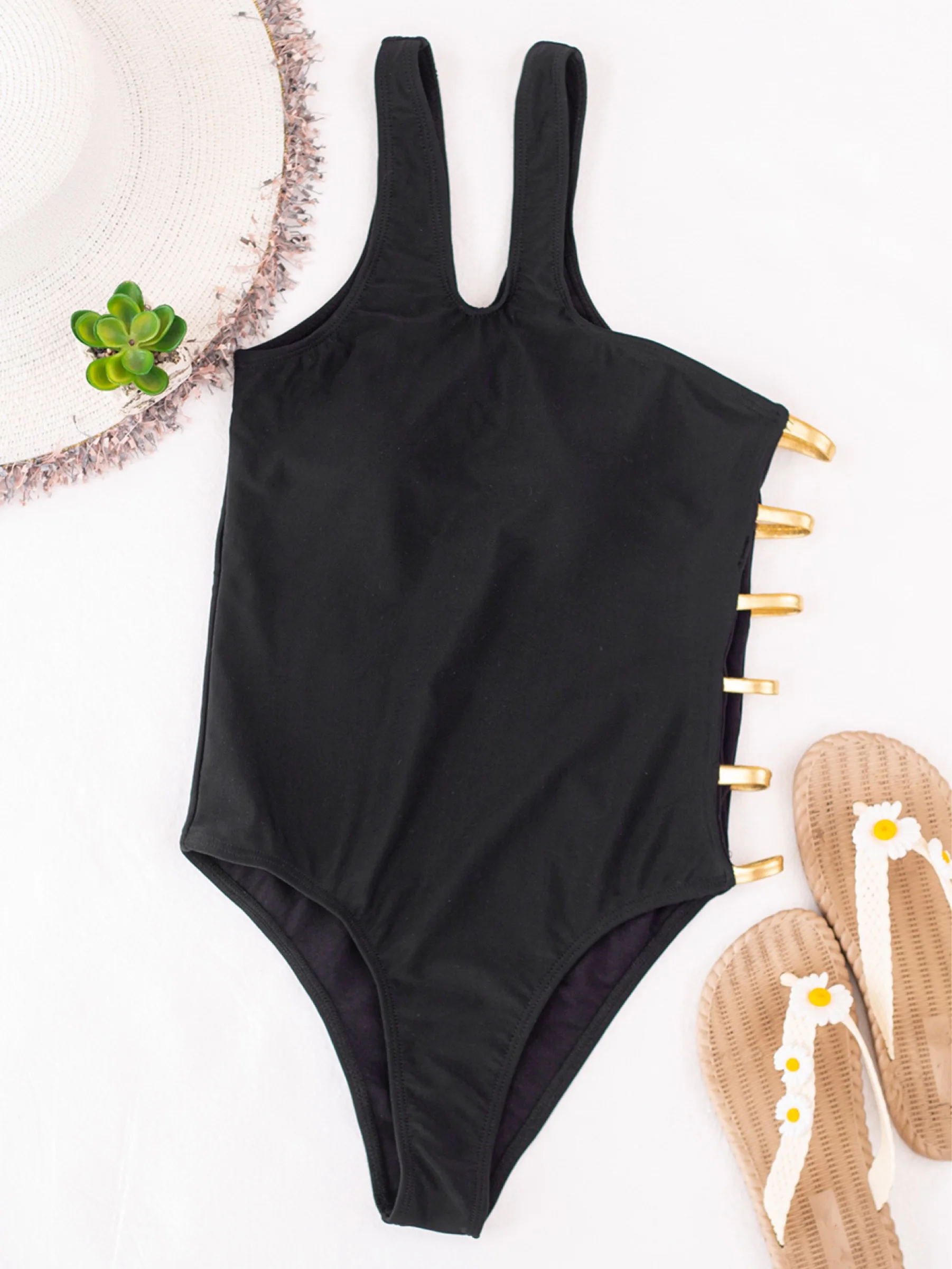 

Black one-piece, solid-colored Bikini